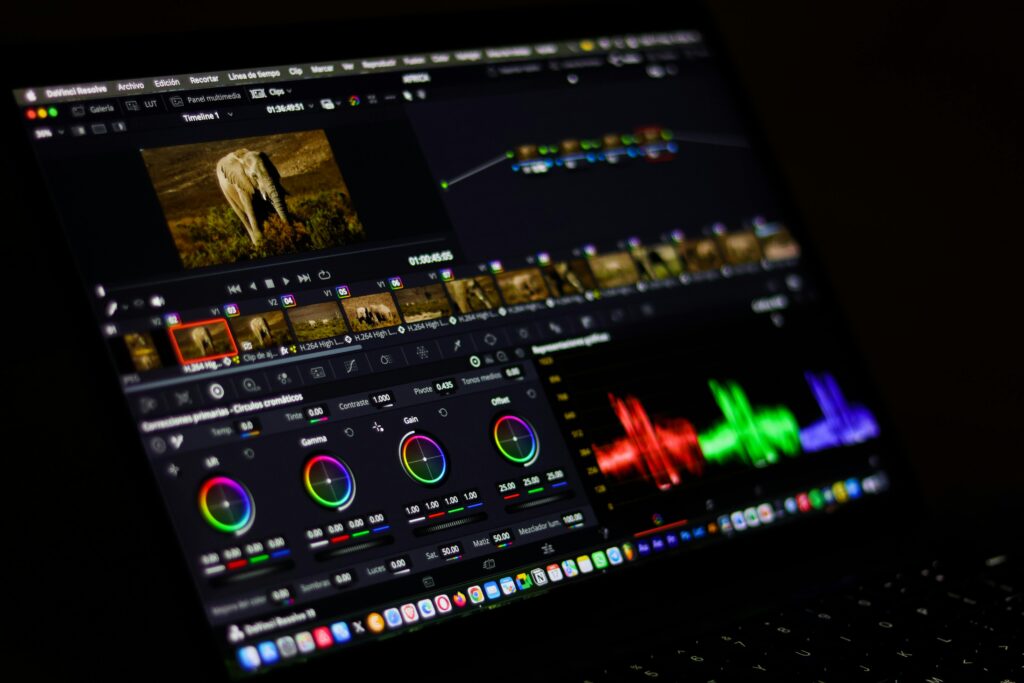 Close-up view of professional video editing software displaying colorful waveforms.